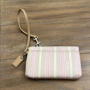 Coach Wristlet with Pink and Cream Stripes in mint condition.